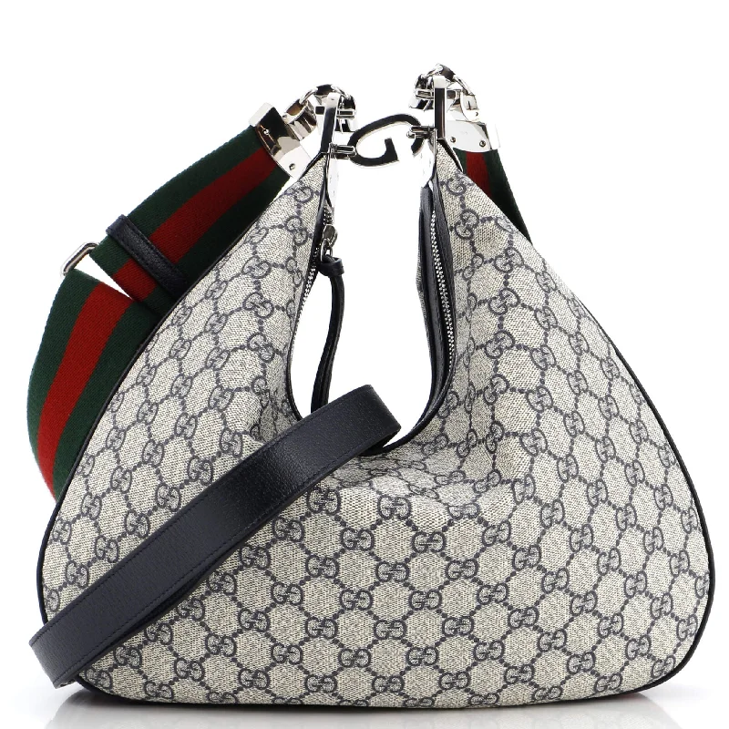 Women Gucci Sylvie bags with a monogram - embossed leatherAttache Shoulder Bag GG Coated Canvas Medium