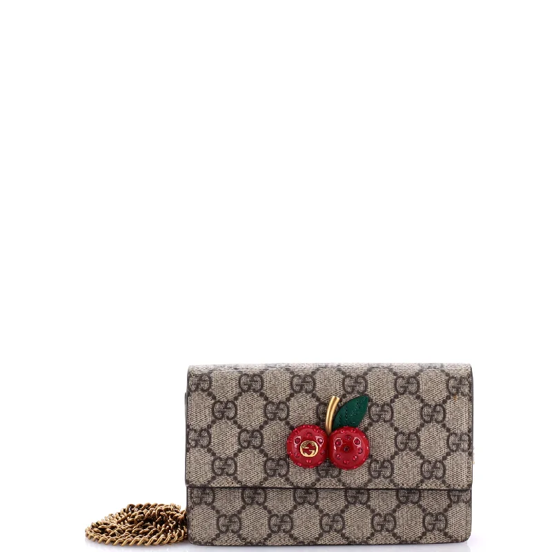 Ladies Gucci shoulder bags with a tassel decorationCherries Wallet on Chain GG Coated Canvas Mini