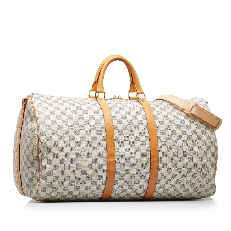 Louis Vuitton Twist bags with a contrast - colored interior for visual interestLOUIS VUITTON Damier Azur Keepall Bandouliere 55 Travel Bag