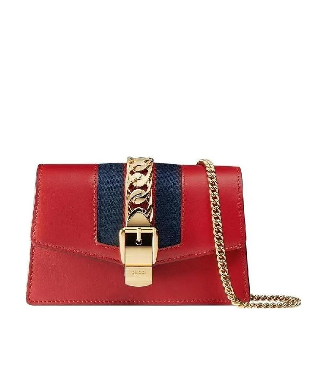 Women Gucci Sylvie bags with a crystal - embellished web stripeGucci