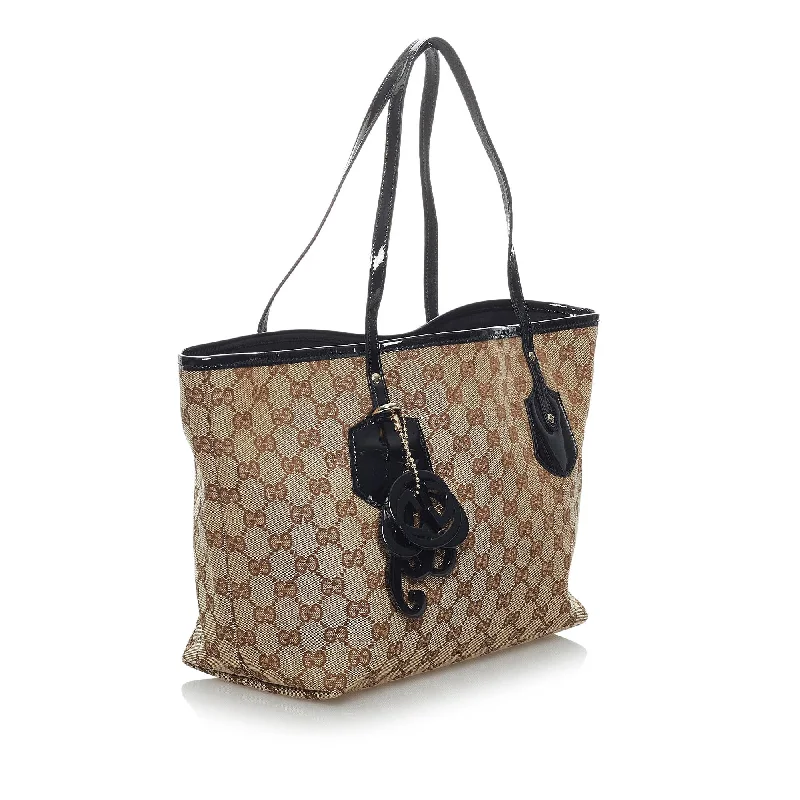 Ladies Gucci shoulder bags with a tassel decorationGucci GG Canvas Jolie Tote Bag (29450)