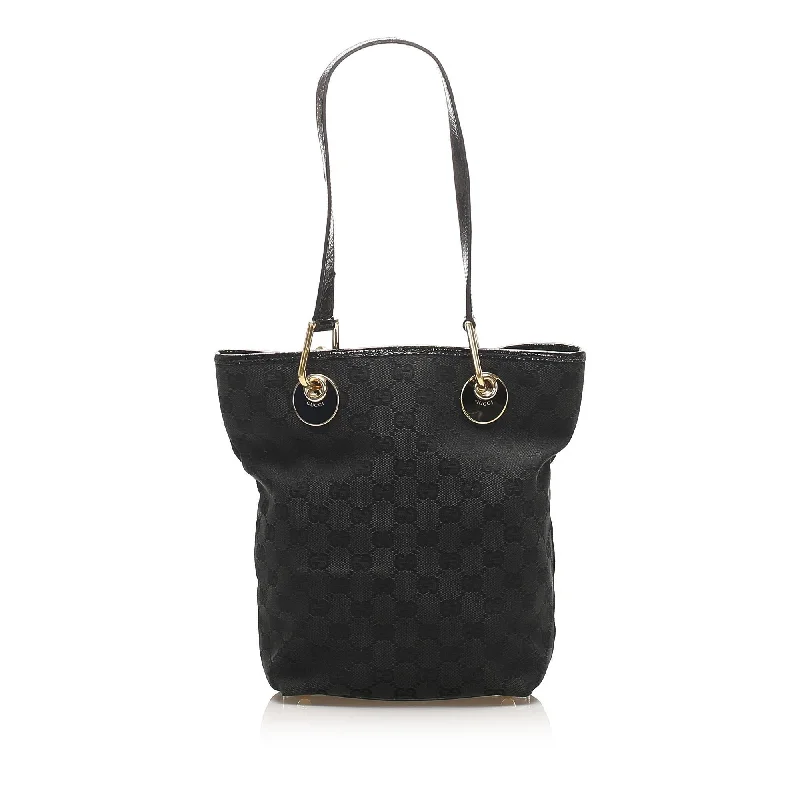 Women Gucci bags with a snap - button closure and a decorative charmGucci GG Canvas Eclipse Tote Bag (SHG-15074)