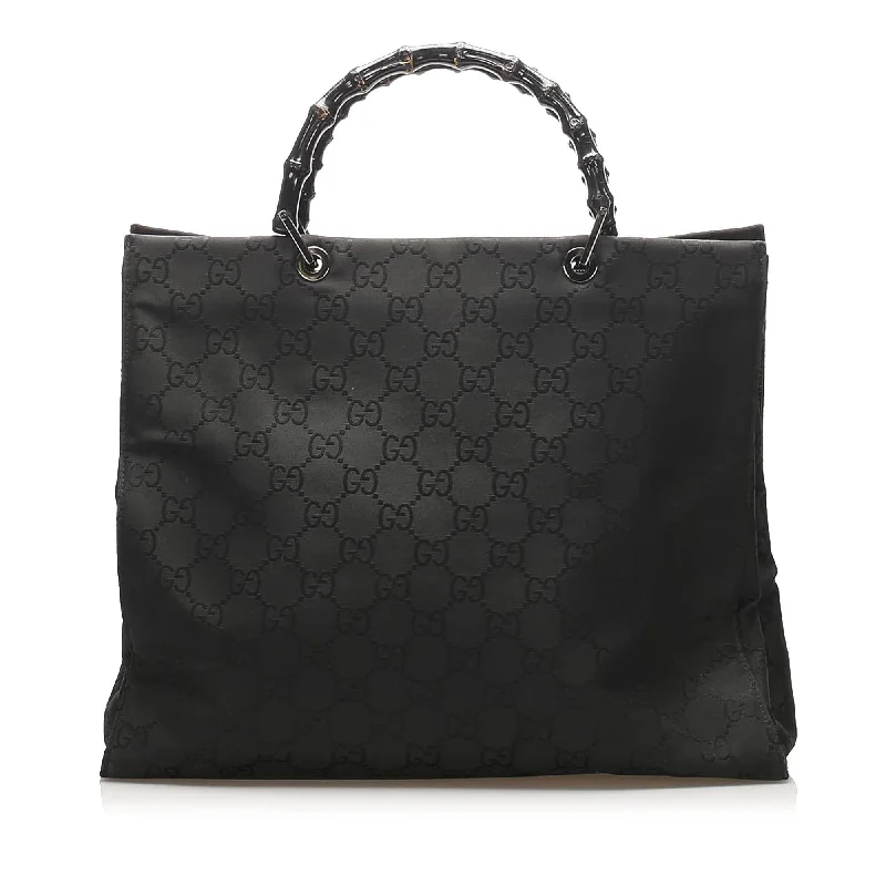 Women Gucci tote bags in GG Supreme canvas for a branded feelGucci GG Nylon Bamboo Tote Bag (SHG-14885)