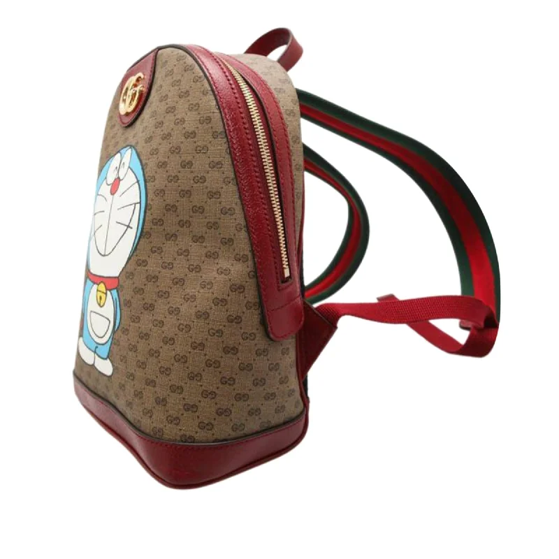 Gucci Marmont bags for women with a snakeskin - effect panelGucci Micro GG Supreme Doraemon Backpack (SHG-ZJXMNs)