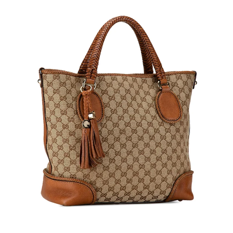 Women Gucci bags with a chain - link trim and a leather bodyGucci GG Canvas Marrakech Tote 6vUBX9)