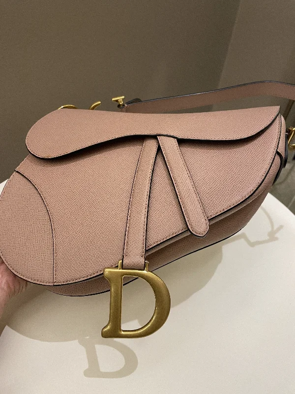 Christian Dior backpacks with a sleek, minimalist silhouetteDior Saddle Bag Nude Blush Grainy Leather